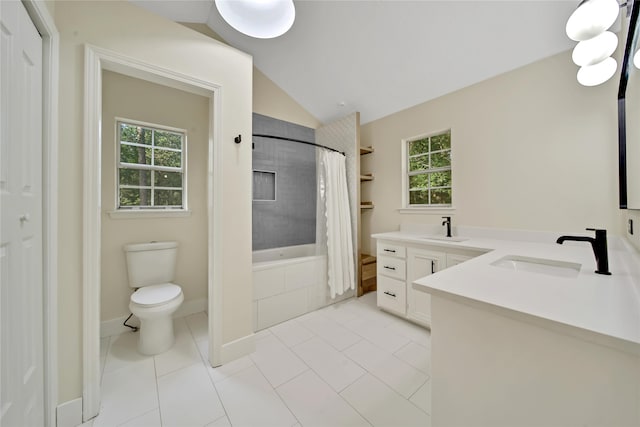 full bathroom featuring a healthy amount of sunlight, vaulted ceiling, vanity, and toilet