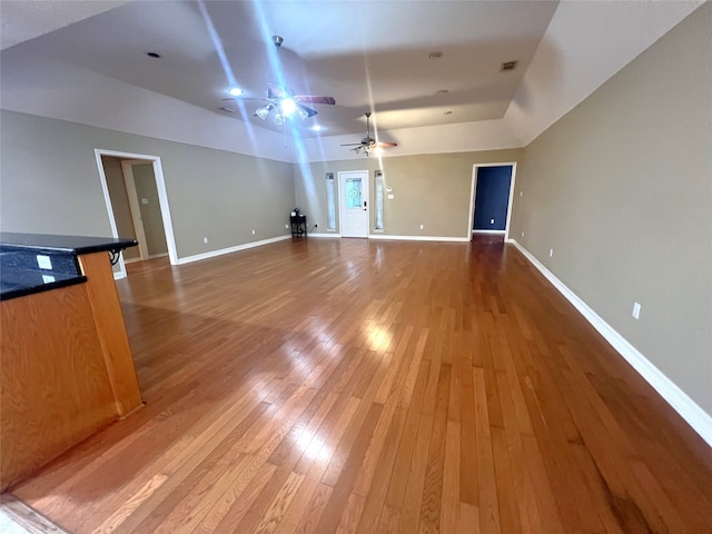 interior space featuring wood-type flooring and ceiling fan