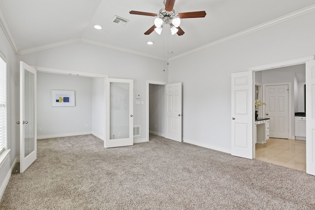 unfurnished bedroom featuring multiple windows, lofted ceiling, light carpet, crown molding, and ceiling fan