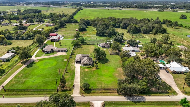 birds eye view of property with a rural view