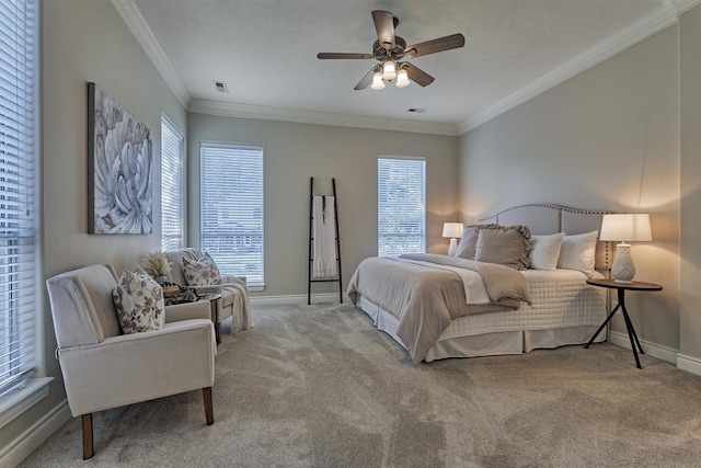 carpeted bedroom featuring ceiling fan, crown molding, and multiple windows