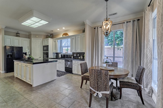 kitchen featuring decorative backsplash, ornamental molding, black appliances, decorative light fixtures, and a kitchen island