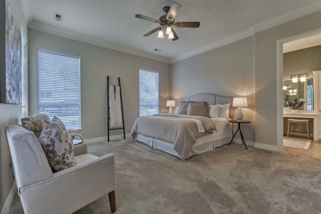 carpeted bedroom featuring ceiling fan, crown molding, and ensuite bathroom