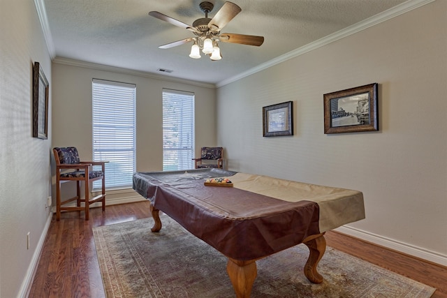 recreation room with crown molding, pool table, ceiling fan, and hardwood / wood-style flooring