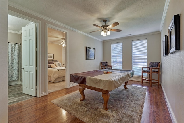 rec room featuring hardwood / wood-style flooring, crown molding, a textured ceiling, and billiards