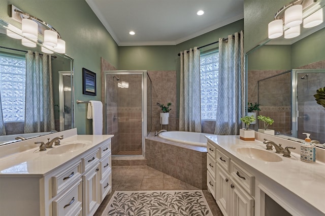 bathroom with tile patterned floors, vanity, independent shower and bath, and ornamental molding