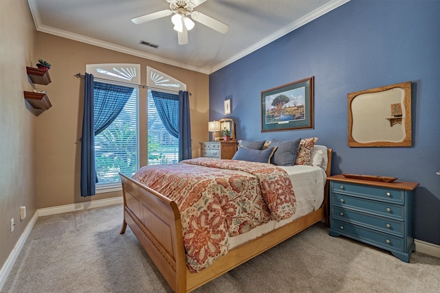 carpeted bedroom featuring ceiling fan and ornamental molding