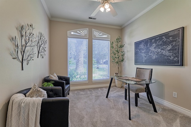 office featuring light carpet, ceiling fan, and ornamental molding