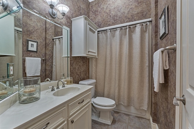 full bathroom featuring toilet, shower / bath combination with curtain, vanity, and tile patterned floors