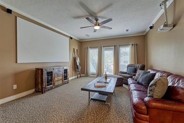 living room featuring ceiling fan, carpet, a textured ceiling, and ornamental molding