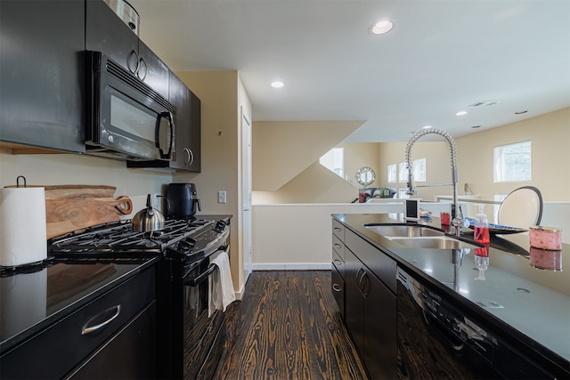 kitchen with black appliances, dark hardwood / wood-style floors, and sink