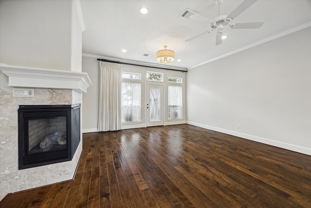 unfurnished living room featuring ornamental molding, ceiling fan, and dark wood-type flooring