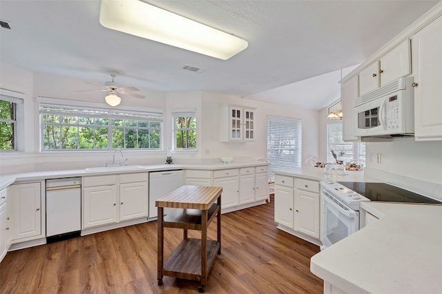 kitchen featuring white cabinetry, white appliances, ceiling fan, and plenty of natural light