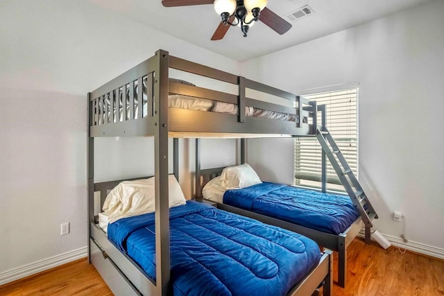 bedroom featuring ceiling fan and wood-type flooring