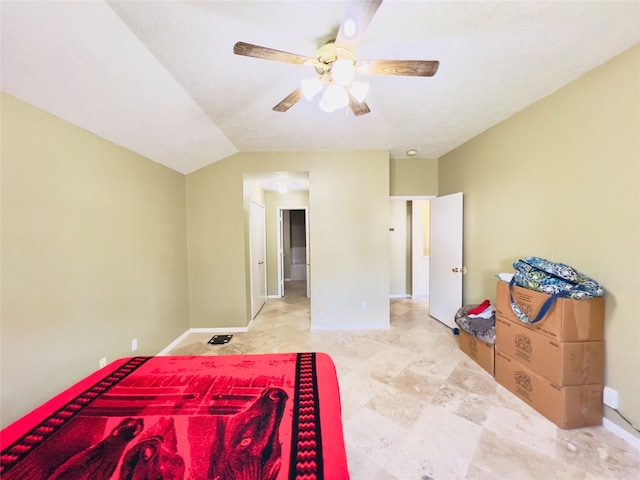 bedroom featuring a textured ceiling, ceiling fan, and lofted ceiling