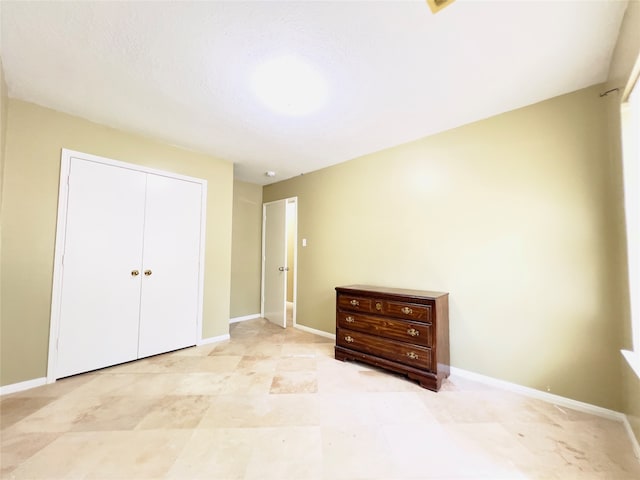 unfurnished bedroom featuring a closet