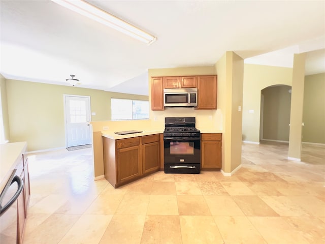 kitchen with kitchen peninsula and stainless steel appliances