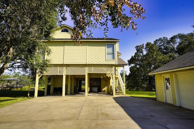 view of front facade with a garage and a carport