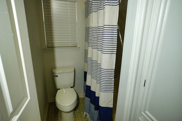 bathroom featuring toilet