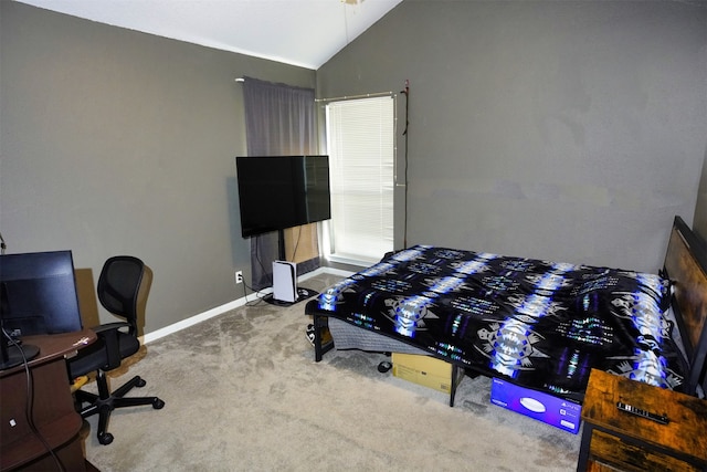 bedroom with lofted ceiling and carpet flooring