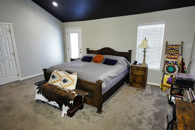 bedroom with vaulted ceiling and carpet