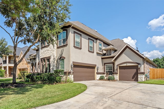 view of front of property featuring a front lawn and a garage