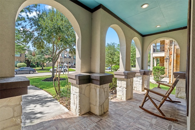 view of patio featuring a balcony