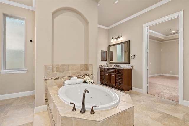 bathroom featuring crown molding, tiled tub, and vanity