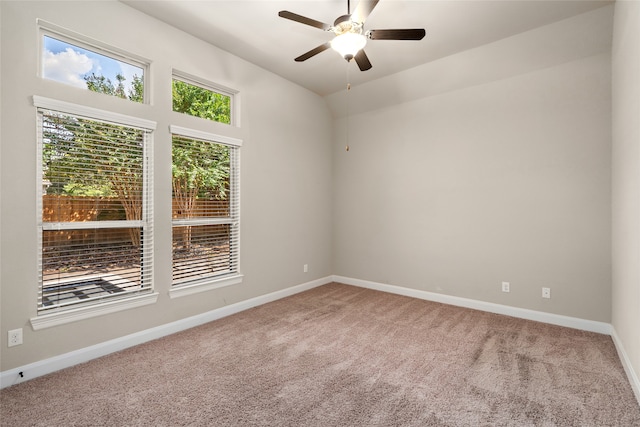 unfurnished room with carpet flooring and ceiling fan