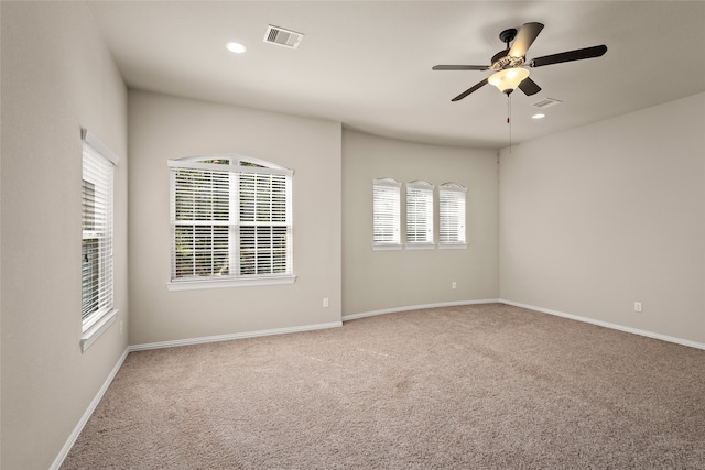 empty room featuring ceiling fan and carpet flooring