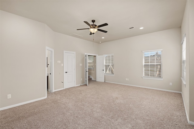 unfurnished bedroom featuring ceiling fan and light colored carpet