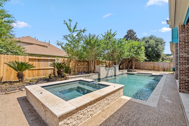 view of swimming pool featuring an in ground hot tub and pool water feature