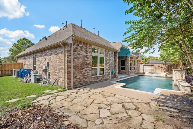 view of swimming pool featuring cooling unit and a patio area