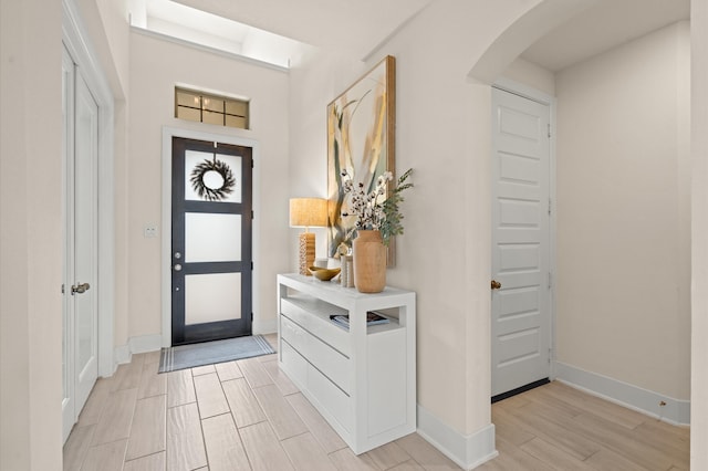 foyer entrance with light hardwood / wood-style floors