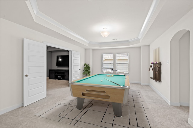 rec room featuring light carpet, a tray ceiling, and billiards