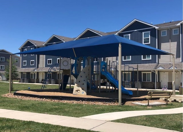 view of playground with a lawn