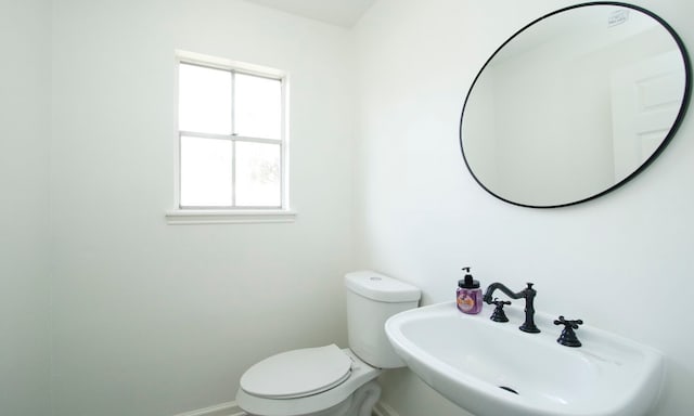 bathroom featuring toilet and sink