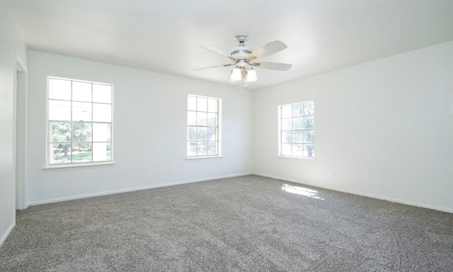 unfurnished room with carpet and ceiling fan