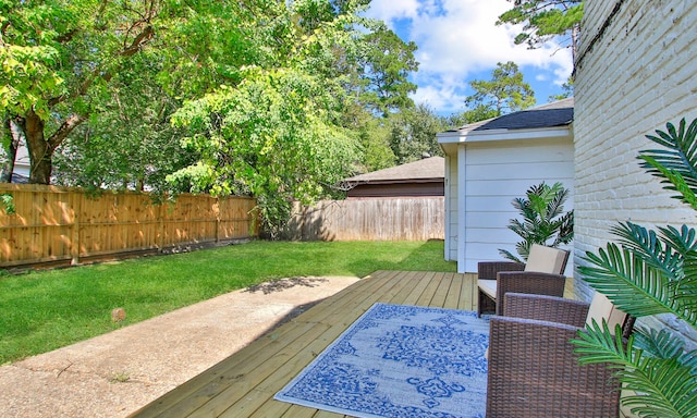 wooden deck with a yard