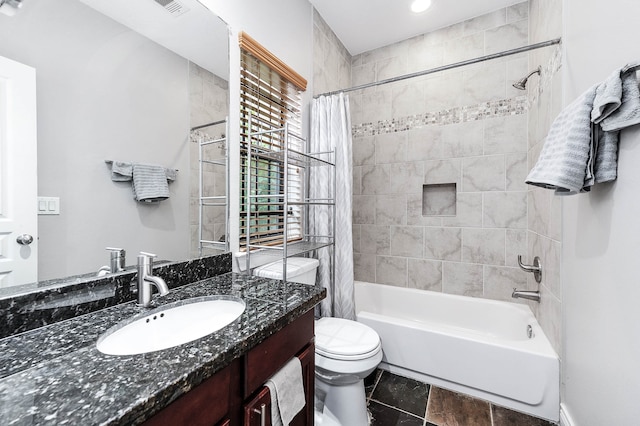 full bathroom with vanity, toilet, and shower / bath combination with curtain