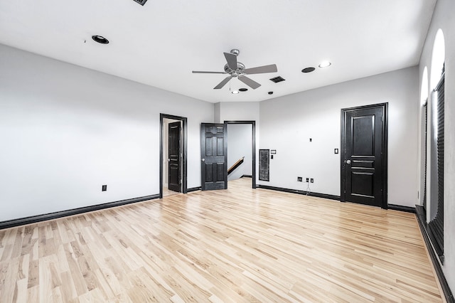 unfurnished bedroom with ceiling fan and light hardwood / wood-style flooring