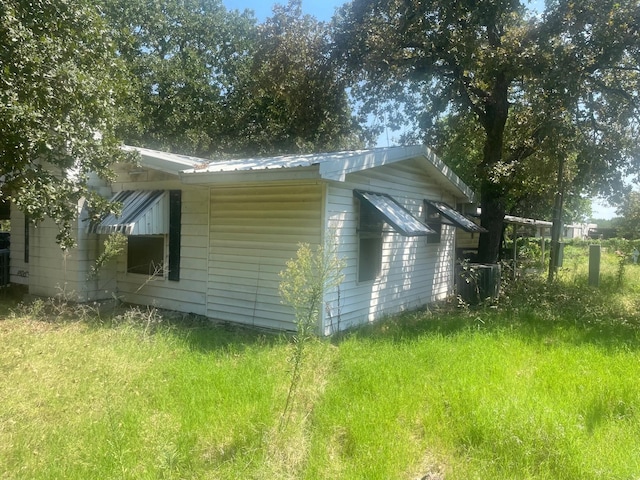 view of home's exterior featuring a lawn