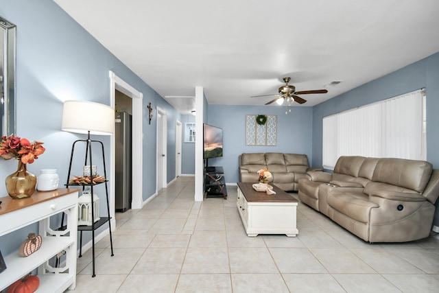 tiled living room featuring ceiling fan