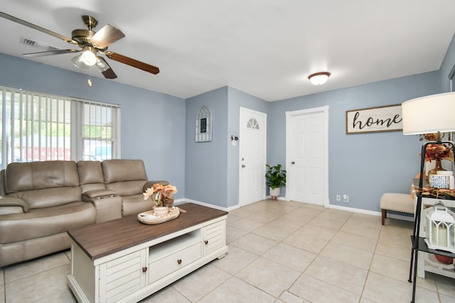 tiled living room with ceiling fan