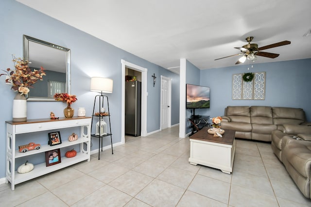 living room featuring light tile patterned floors and ceiling fan