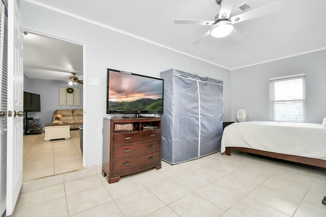 bedroom with light tile patterned flooring and ceiling fan