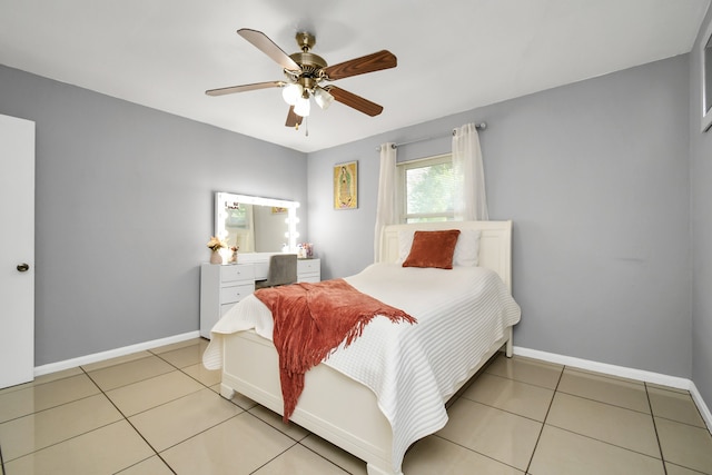 tiled bedroom with ceiling fan