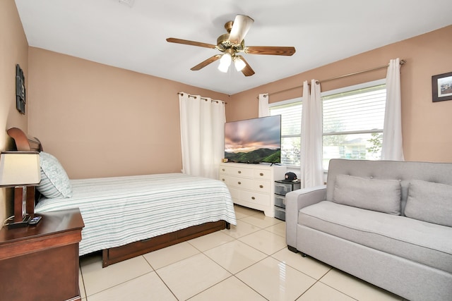 bedroom with light tile patterned floors and ceiling fan