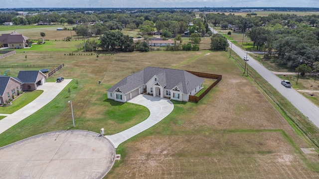 birds eye view of property with a rural view