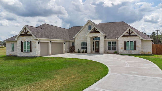 french country inspired facade with a front lawn and a garage